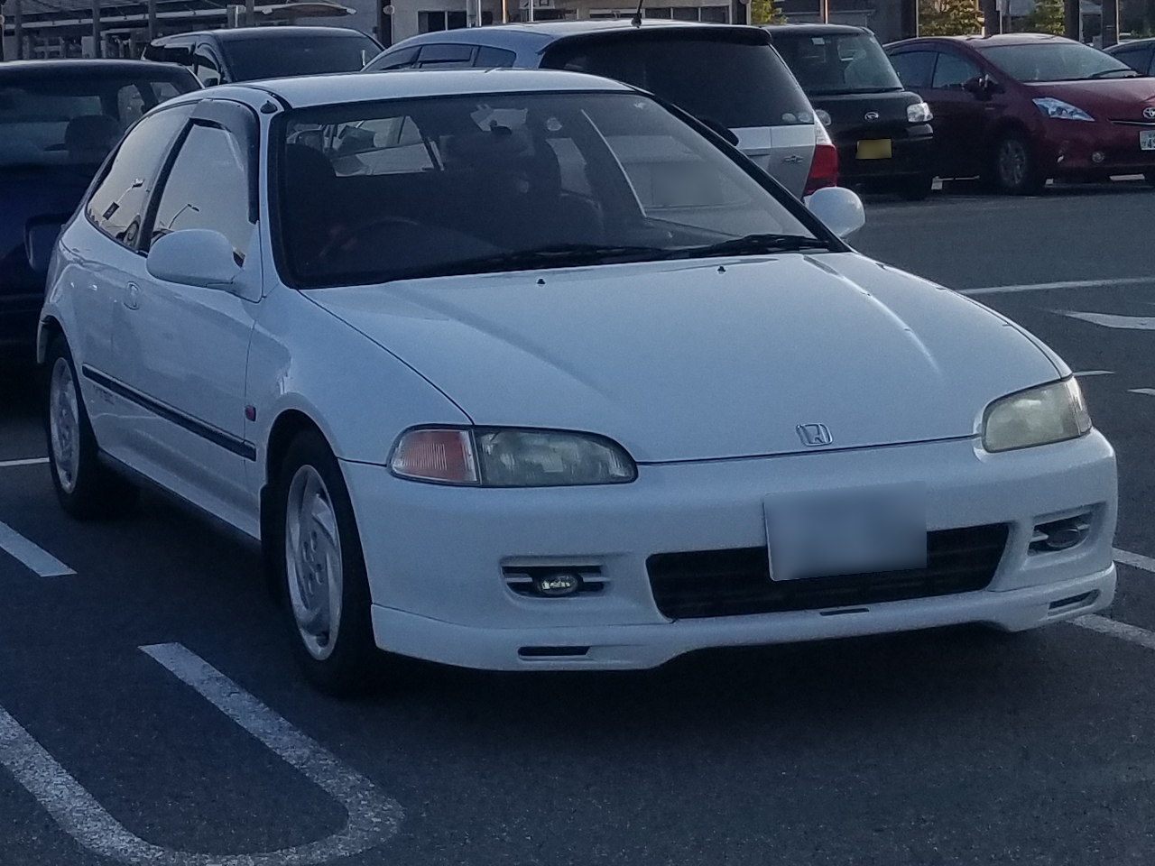 The file page identifies a Honda Civic EG6 SiR and the photographed car matches the fifth-generation three-door SiR/SiR II body and grade family.