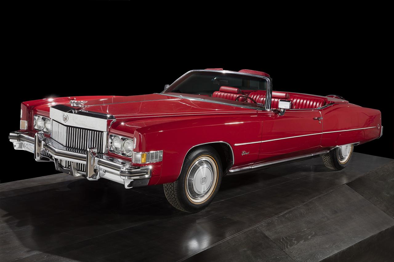 Chuck Berry’s red 1973 Cadillac Eldorado convertible photographed against a black background for the Smithsonian collection.