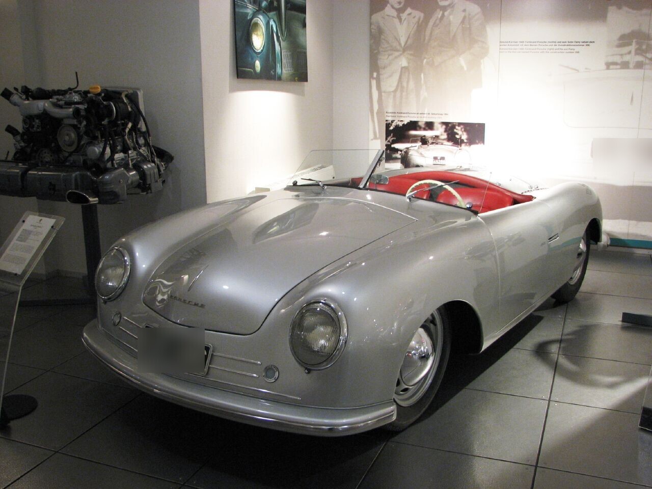 The actual surviving silver Porsche 356 No. 1 Roadster displayed at the Porsche Museum in 2007, viewed from the front left with its historic registration obscured.