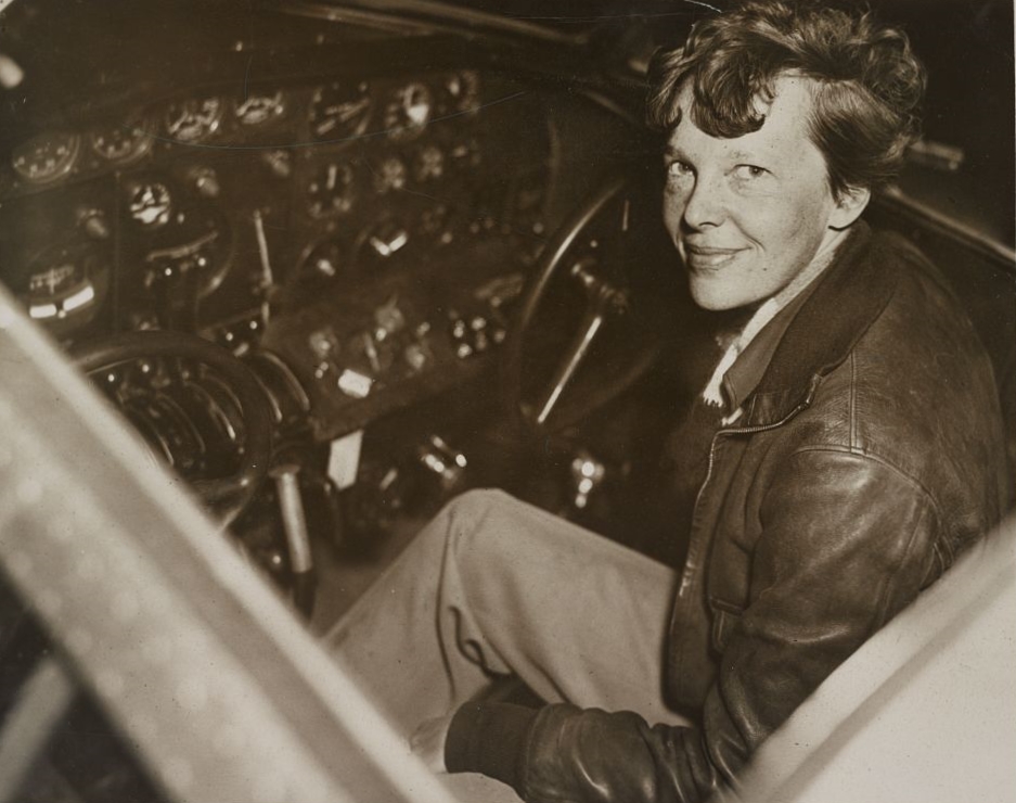 Amelia Earhart seated in the cockpit of an Electra in 1937.