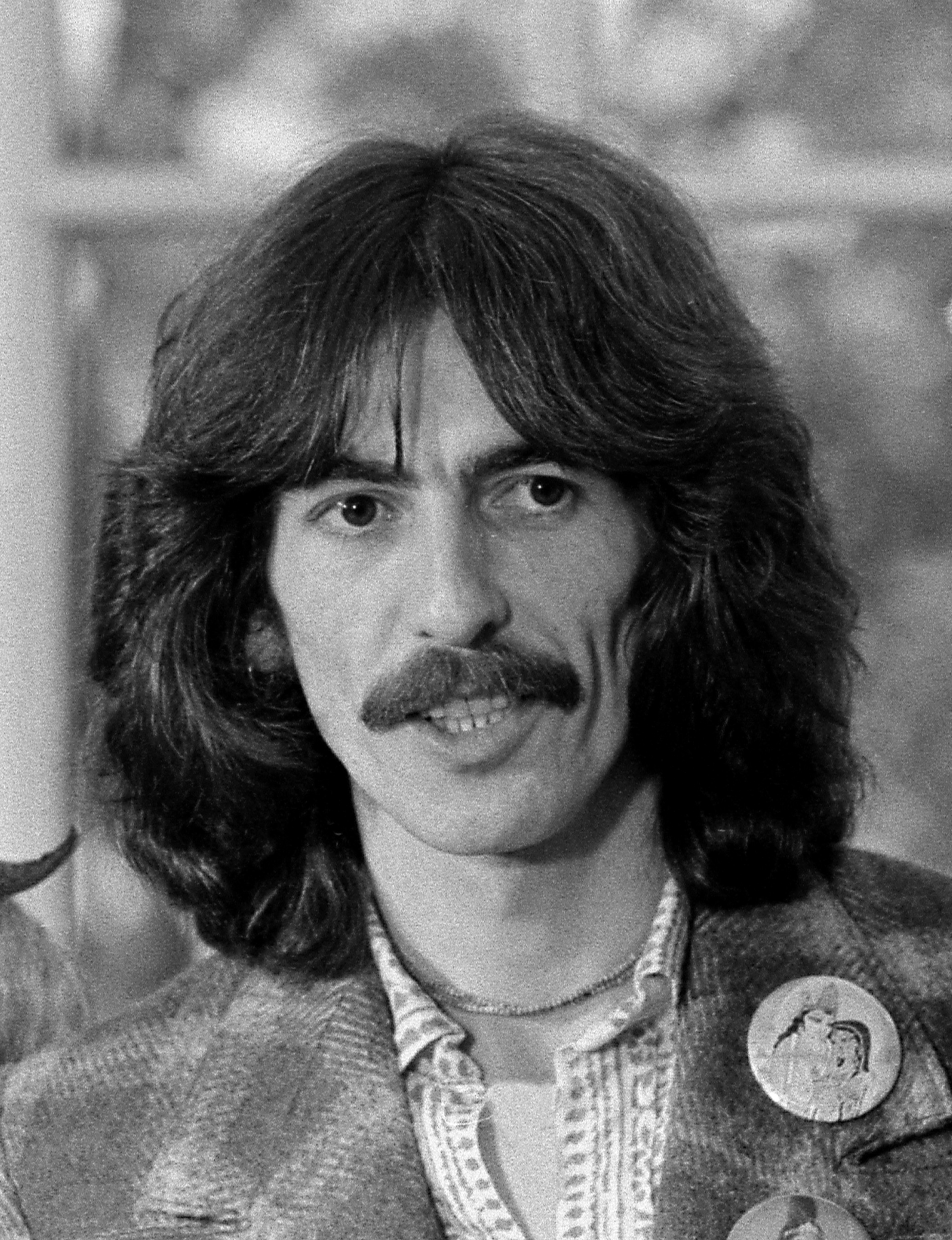 George Harrison in a December 1974 White House identification portrait by David Hume Kennerly.