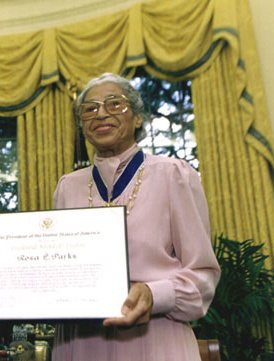Rosa Parks holding her Presidential Medal of Freedom certificate in the Oval Office in 1996.